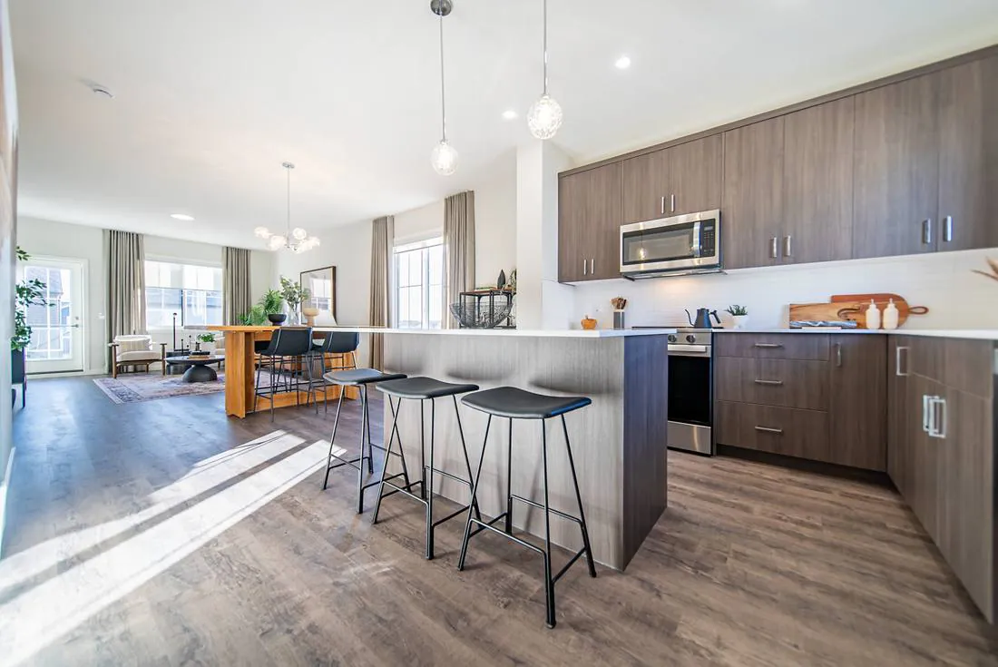 Kitchen with quartz island and stainless appliances
